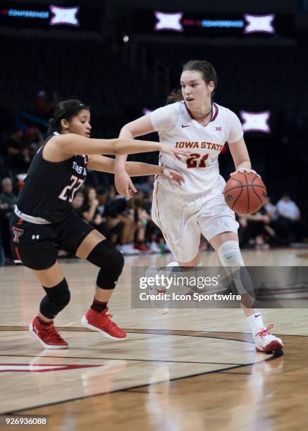 Iowa State Bridget Carleton making a move towards the basket while Texas Tech Angel Hayden plays defense during the Texas Tech Lady Red Raiders Big...