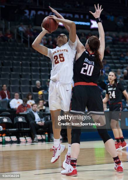 Iowa State Kristin Scott going up for two points while Texas Tech Brittany Brewer plays defense during the Texas Tech Lady Red Raiders Big 12 Women's...