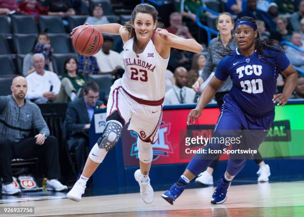 Oklahoma Maddie Manning driving past Texas Christian University Amy Okonkwo during the Oklahoma Sooners Big 12 Women's Championship game versus the...