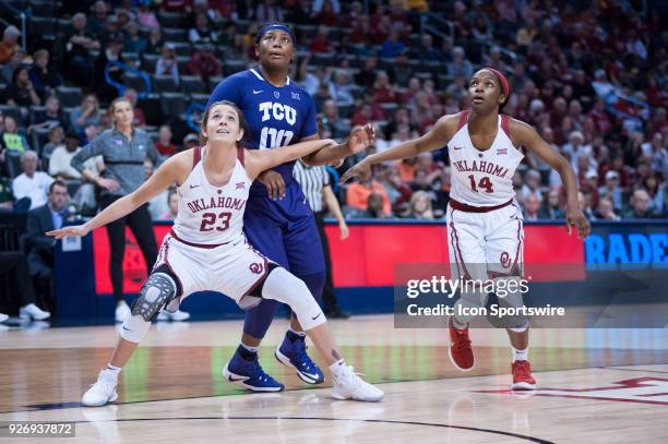 Oklahoma Maddie Manning and Oklahoma Shaina Pellingto blocking out Texas Christian University Amy Okonkwo during the Oklahoma Sooners Big 12 Women's...