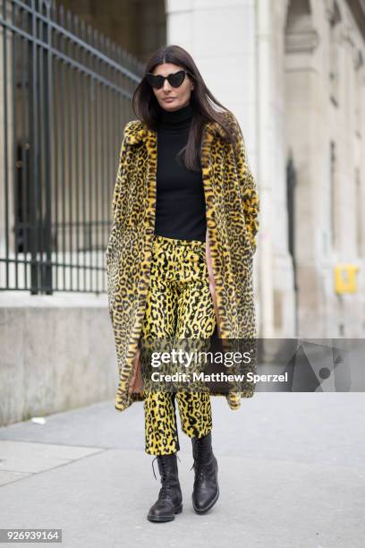 Giovanna Battaglia Engelbert is seen on the street attending Noir Kei Ninomiya during Paris Women's Fashion Week A/W 2018 wearing a yellow animal...