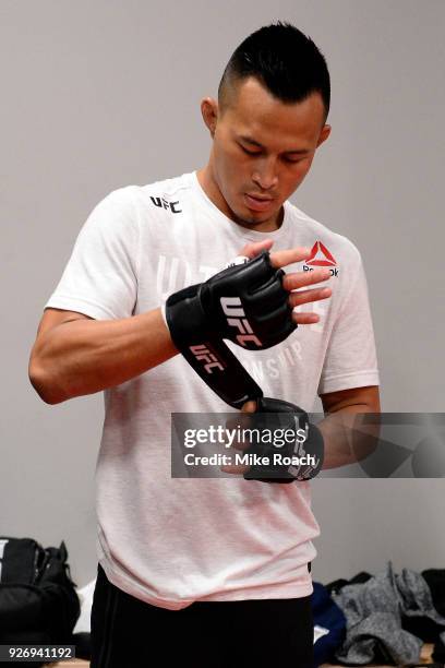 Andre Soukhamthath straps on his gloves backstage prior to his bout against Sean O'Malley during the UFC 222 event inside T-Mobile Arena on March 3,...