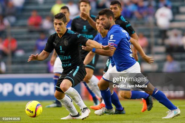 Javier Guemez of Queretaro and Martin Cauteruccio of Cruz Azul fight for the ball during the 10th round match between Cruz Azul and Queretaro as part...