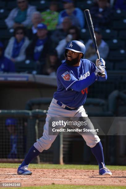 Andrew Toles of the Los Angeles Dodgers stands at bat in the spring training game against the Kansas City Royals at Surprise Stadium on February 24,...