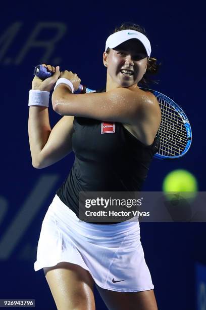 Rebecca Peterson of Sweden returns a shot during a semifinal match between Stefanie Voegele of Switzerland and Rebecca Peterson of Sweden as part of...