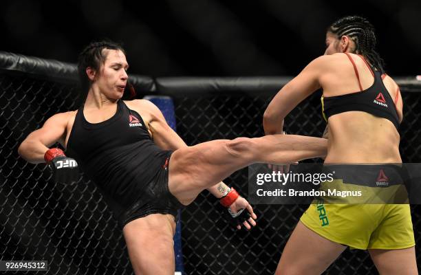 Cat Zingano kicks Ketlen Vieira of Brazil in their women's bantamweight bout during the UFC 222 event inside T-Mobile Arena on March 3, 2018 in Las...