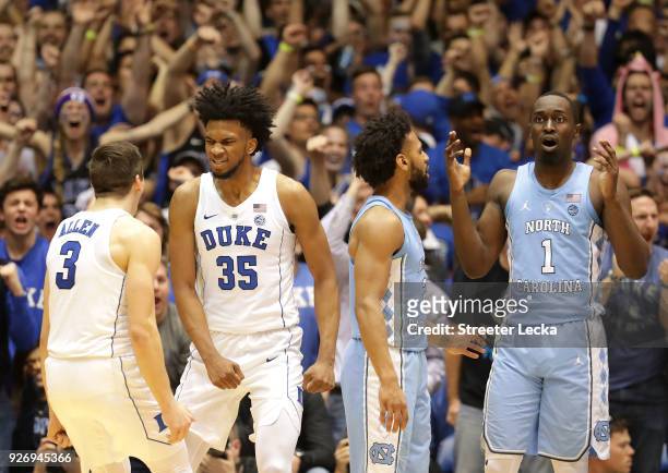 Teammates Marvin Bagley III and Grayson Allen of the Duke Blue Devils react after a play against teammates Joel Berry II and Theo Pinson of the North...