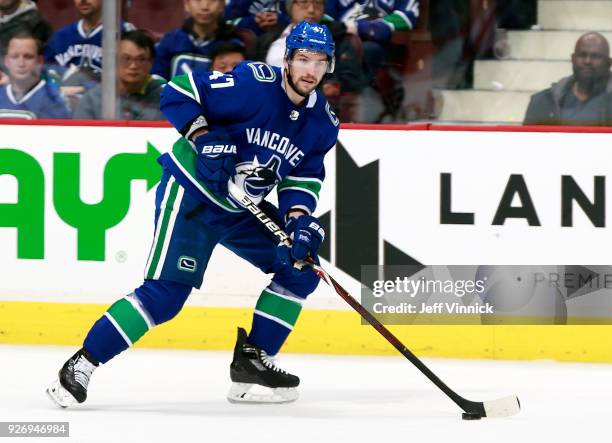 Sven Baertschi of the Vancouver Canucks skates up ice with the puck during their NHL game against the New York Rangers at Rogers Arena February 28,...