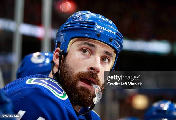 Erik Gudbranson of the Vancouver Canucks looks on from the bench during their NHL game against the New York Rangers at Rogers Arena February 28, 2018...