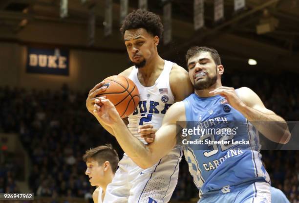 Gary Trent Jr. #2 of the Duke Blue Devils goes after a loose ball against Luke Maye of the North Carolina Tar Heels during their game at Cameron...