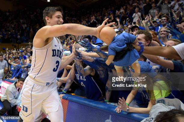 Grayson Allen of the Duke Blue Devils celebrates with the Cameron Crazies following their game against the North Carolina Tar Heels at Cameron Indoor...