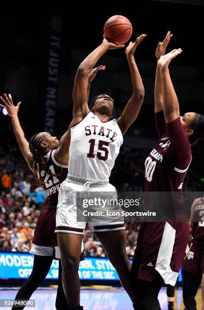 Mississippi State Lady Bulldogs center Teaira McCowan shoots the ball over Texas A&M Aggies center Khaalia Hillsman during the first period between...