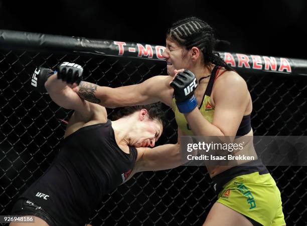 Cat Zingano and Ketlen Vieira fight during their women's bantamweight bout during UFC 222 at T-Mobile Arena on March 3, 2018 in Las Vegas, Nevada....