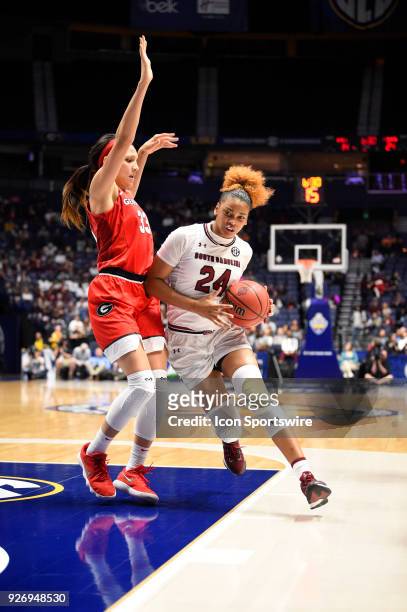 S34\ dribbles the ball against Georgia Bulldogs forward Mackenzie Engram during the second period between the South Carolina Gamecocks and the...