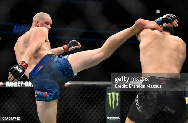 Stefan Struve of The Netherlands kicks Andrei Arlovski of Belarus in their heavyweight bout during the UFC 222 event inside T-Mobile Arena on March...