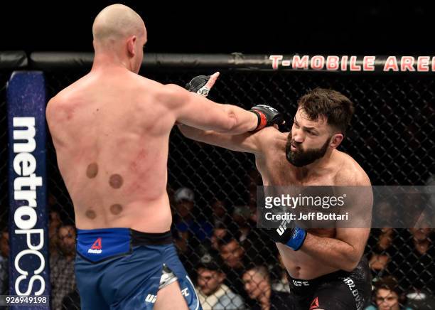 Andrei Arlovski of Belarus punches Stefan Struve of The Netherlands in their heavyweight bout during the UFC 222 event inside T-Mobile Arena on March...