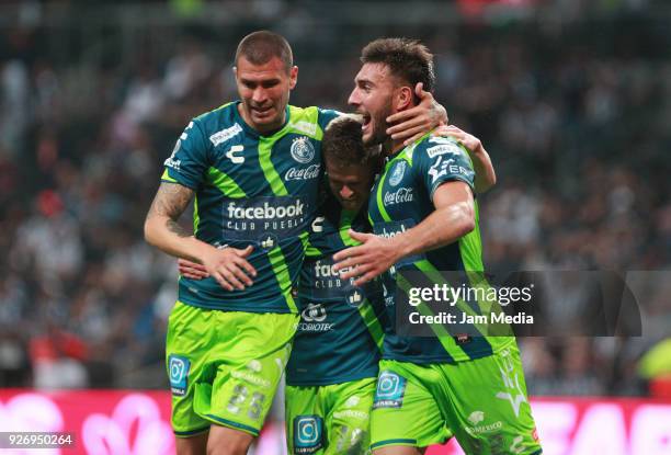 Jorge Enriquez Diego Cruz of Puebla and Lucas Cavallini of Puebla celebrate the third goal of their team, during the 10th round match between...