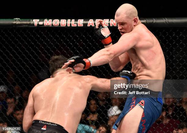 Andrei Arlovski of Belarus punches the body of Stefan Struve of The Netherlands in their heavyweight bout during the UFC 222 event inside T-Mobile...