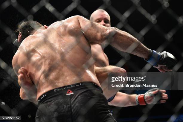 Stefan Struve of The Netherlands kicks the body of Andrei Arlovski of Belarus in their heavyweight bout during the UFC 222 event inside T-Mobile...