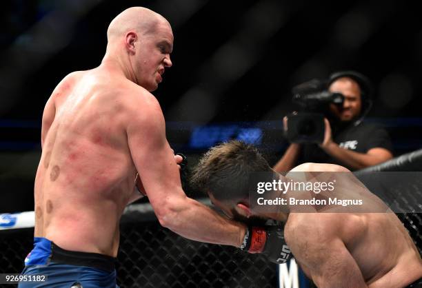 Stefan Struve of The Netherlands punches Andrei Arlovski of Belarus in their heavyweight bout during the UFC 222 event inside T-Mobile Arena on March...