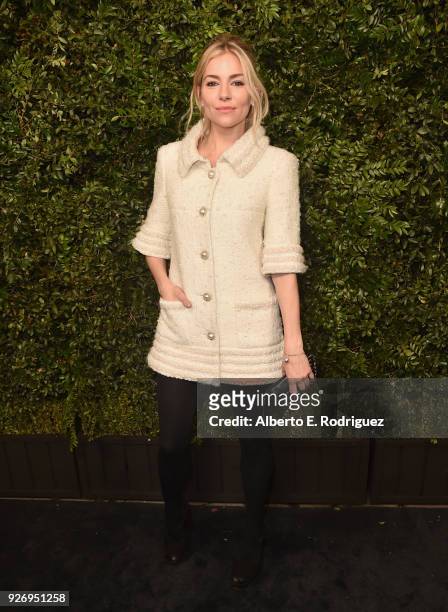 Sienna Miller, wearing CHANEL, attends Charles Finch and Chanel Pre-Oscar Awards Dinner at Madeo in Beverly Hills on March 3, 2018 in Beverly Hills,...