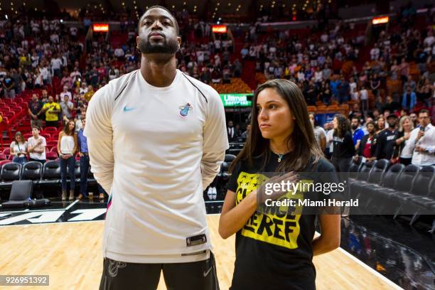 The Miami Heat's Dwyane Wade stands next to Andrea Ghersi, the sister of Joaquin Oliver who was killed in the Marjory Stoneman Douglas High School...