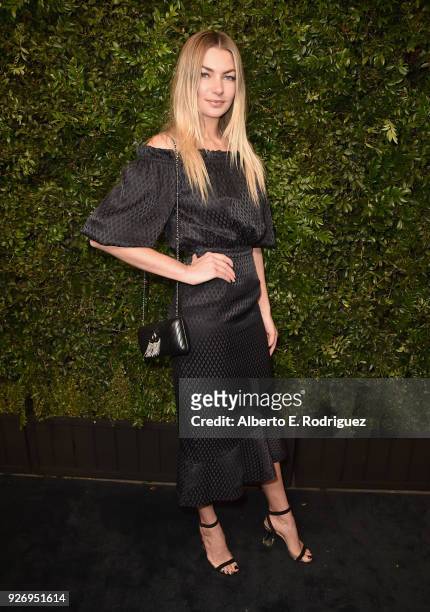 Jessica Hart, wearing CHANEL, attends Charles Finch and Chanel Pre-Oscar Awards Dinner at Madeo in Beverly Hills on March 3, 2018 in Beverly Hills,...