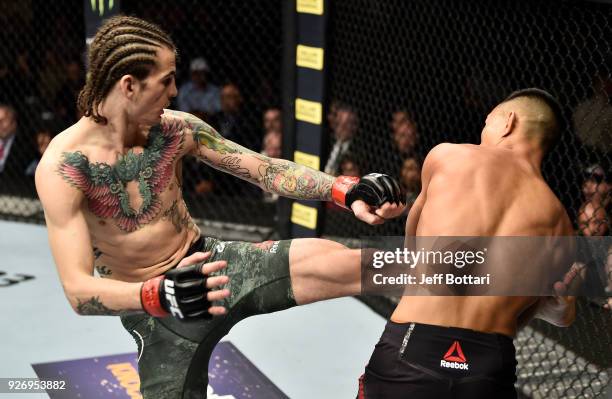 Sean O'Malley kicks Andre Soukhamthath in their bantamweight bout during the UFC 222 event inside T-Mobile Arena on March 3, 2018 in Las Vegas,...