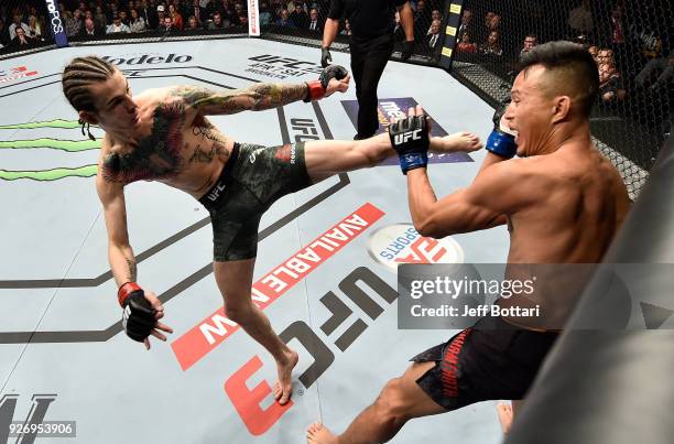 Sean O'Malley kicks Andre Soukhamthath in their bantamweight bout during the UFC 222 event inside T-Mobile Arena on March 3, 2018 in Las Vegas,...