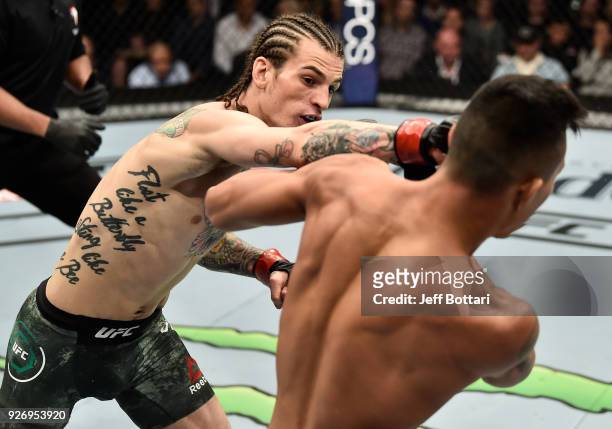 Sean O'Malley punches Andre Soukhamthath in their bantamweight bout during the UFC 222 event inside T-Mobile Arena on March 3, 2018 in Las Vegas,...