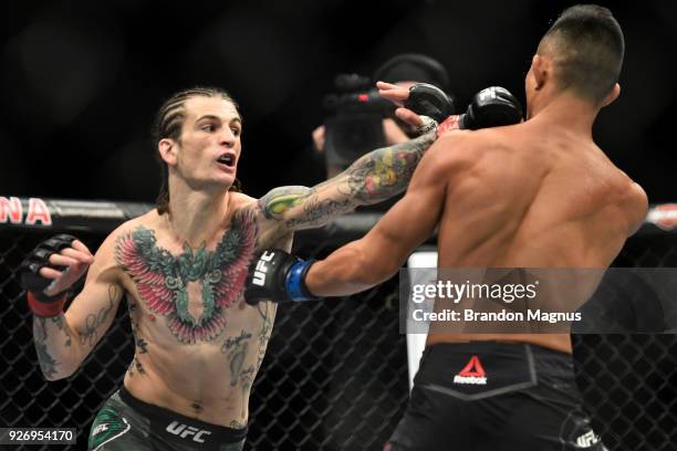 Sean O'Malley punches Andre Soukhamthath in their bantamweight bout during the UFC 222 event inside T-Mobile Arena on March 3, 2018 in Las Vegas,...