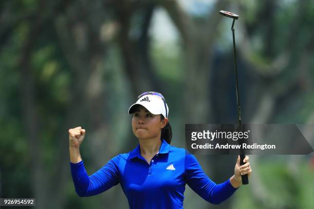 Danielle Kang of the United States celebrates after saving par on the 12th green during the final round of the HSBC Women's World Championship at...
