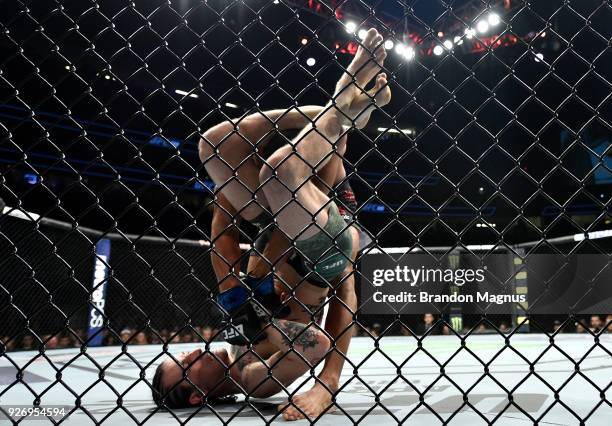 Sean O'Malley attempts to secure an arm bar submission against Andre Soukhamthath in their bantamweight bout during the UFC 222 event inside T-Mobile...