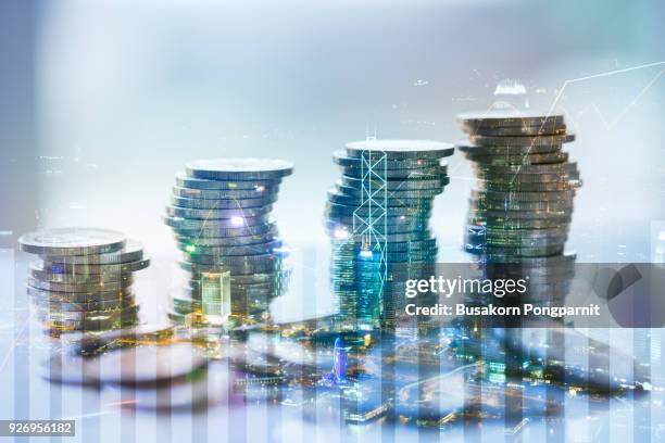 double exposure of city with graph and stack of coins for finance and business concept - money growth stock-fotos und bilder