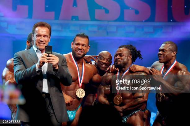 Arnold Schwarzenegger takes a selfie with Steve Kuclo , Dexter Jackson , William Bonac and Lionel Beyeke after Bonac won the Arnold Classic as part...