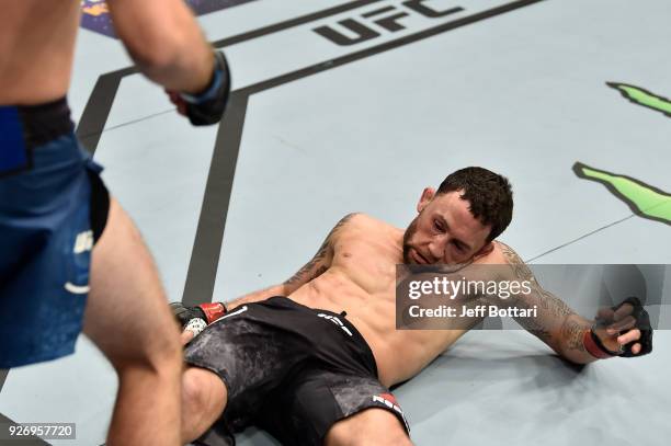 Brian Ortega knocks out Frankie Edgar in their featherweight bout during the UFC 222 event inside T-Mobile Arena on March 3, 2018 in Las Vegas,...