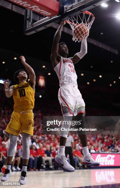 Deandre Ayton of the Arizona Wildcats slam dunks the ball against the California Golden Bears during the second half of the college basketball game...
