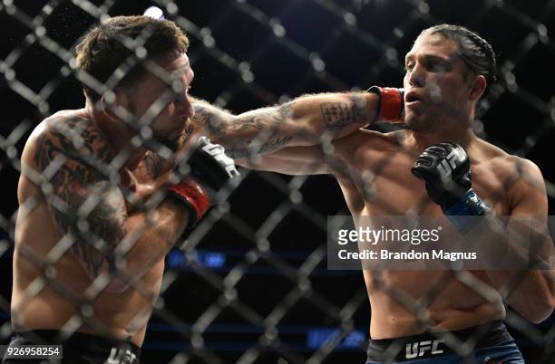 Brian Ortega punches Frankie Edgar in their featherweight bout during the UFC 222 event inside T-Mobile Arena on March 3, 2018 in Las Vegas, Nevada.