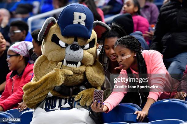 Butler Bulldogs mascot takes a selfie with fans during the game against the Providence Lady Friars on March 3, 2018 at the Wintrust Arena located in...