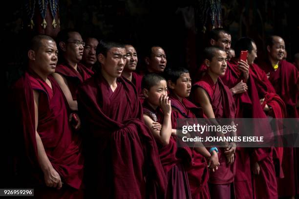 This picture taken on March 1, 2018 shows Tibetan Buddhist monks attending a ceremony for Monlam, otherwise known as the Great Prayer Festival of...