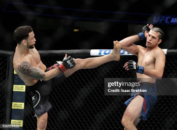 Frankie Edgar and Brian Ortega fight during their featherweight bout during UFC 222 at T-Mobile Arena on March 3, 2018 in Las Vegas, Nevada. Ortega...