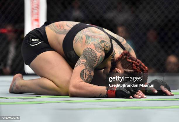 Cris Cyborg of Brazil celebrates after her TKO victory over Yana Kunitskaya of Russia in their women's featherweight bout during the UFC 222 event...