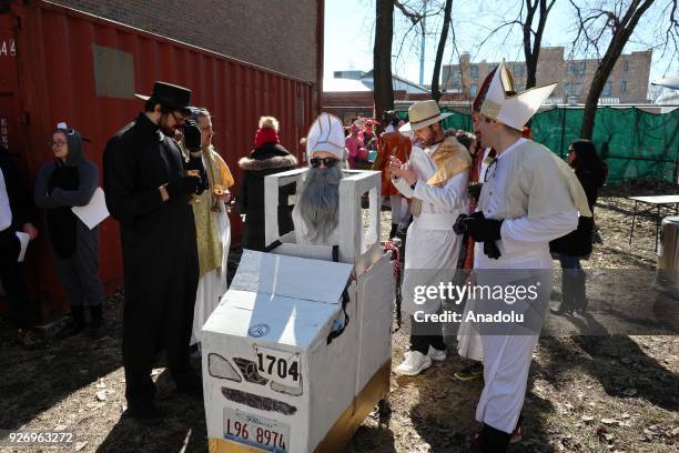 People participate in the "CHIditarod" shopping cart race in Chicago, Illinois, United States on March 03, 2018. People design and create their own...