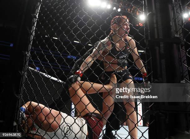 Referee Herb Dean steps in to stop the fight between Cris Cyborg and Yana Kunitskaya during their womenÕs featherweight title bout during UFC 222 at...