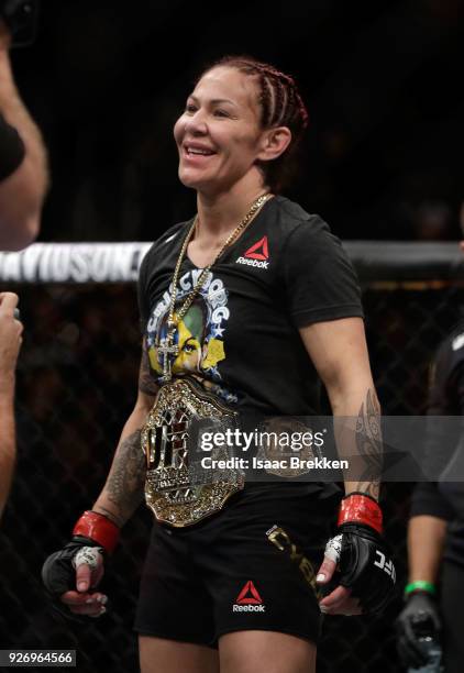 Cris Cyborg celebrates her victory over Yana Kunitskaya following their womens featherweight title bout during UFC 222 at T-Mobile Arena on March 3,...