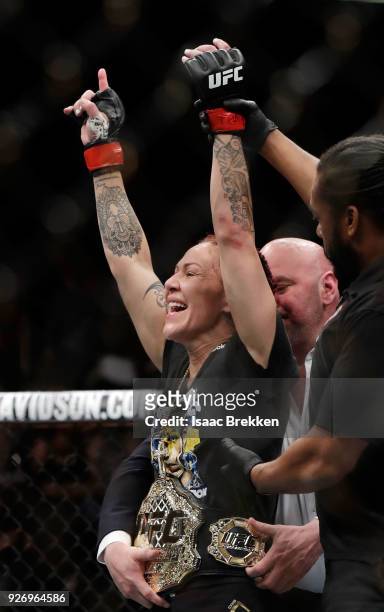 Cris Cyborg celebrates her victory over Yana Kunitskaya following their womens featherweight title bout during UFC 222 at T-Mobile Arena on March 3,...