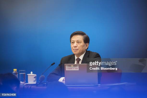 Zhang Yesui, China's vice foreign minister and spokesman for the National People's Congress , listens during a news conference ahead of the first...