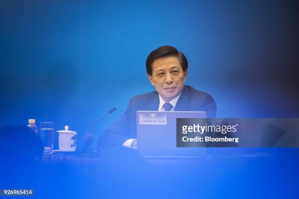 Zhang Yesui, China's vice foreign minister and spokesman for the National People's Congress , listens during a news conference ahead of the first...