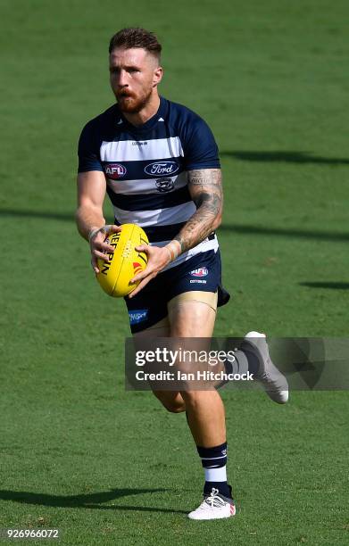 Zach Tuohy of the Cats runs the ball during the AFL JLT Community Series match between the Geelong Cats and the Gold Coast Suns at Riverway Stadium...