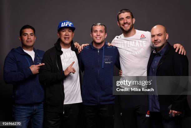 Brian Ortega poses for a portrait backstage with his team after his victory over Frankie Edgar during the UFC 222 event inside T-Mobile Arena on...